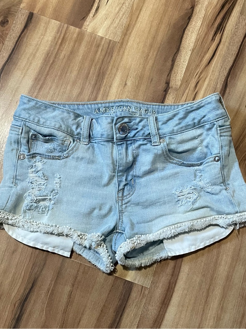 American Eagle Light Wash Pom-Pom Fringe Shortie Shorts - Distressed Size 4